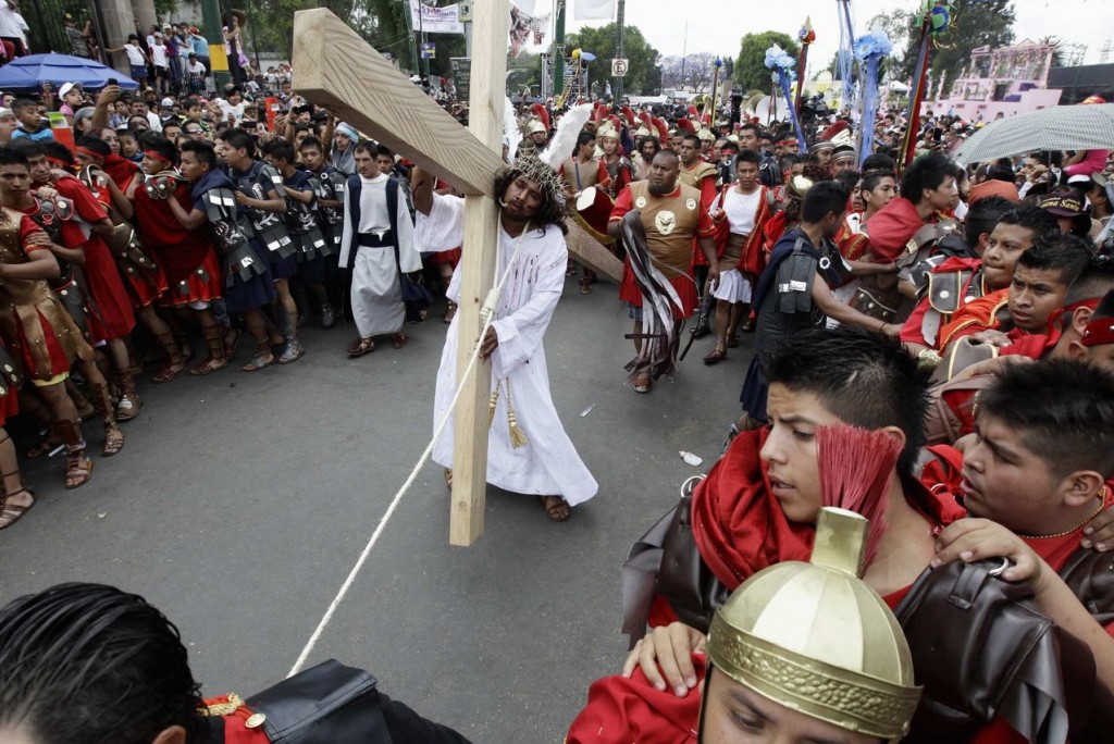 Penitents participate in a re-enactment of the crucifixion of Jesus Christ on Good Friday in Iztapalapa in Mexico City